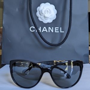 Chanel Authentic cat eye black frame gold chain and leather sunglasses.